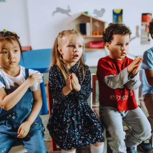 Girl playing with wooden animals